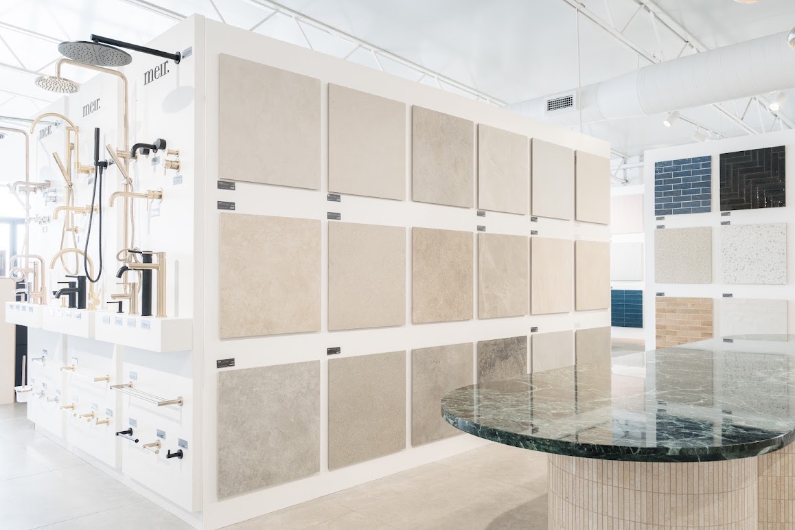 Tile Republic showroom with tile displays and a stone table
