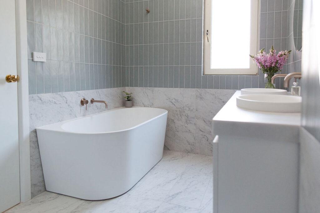 Half height marble tile and the rest subway tile