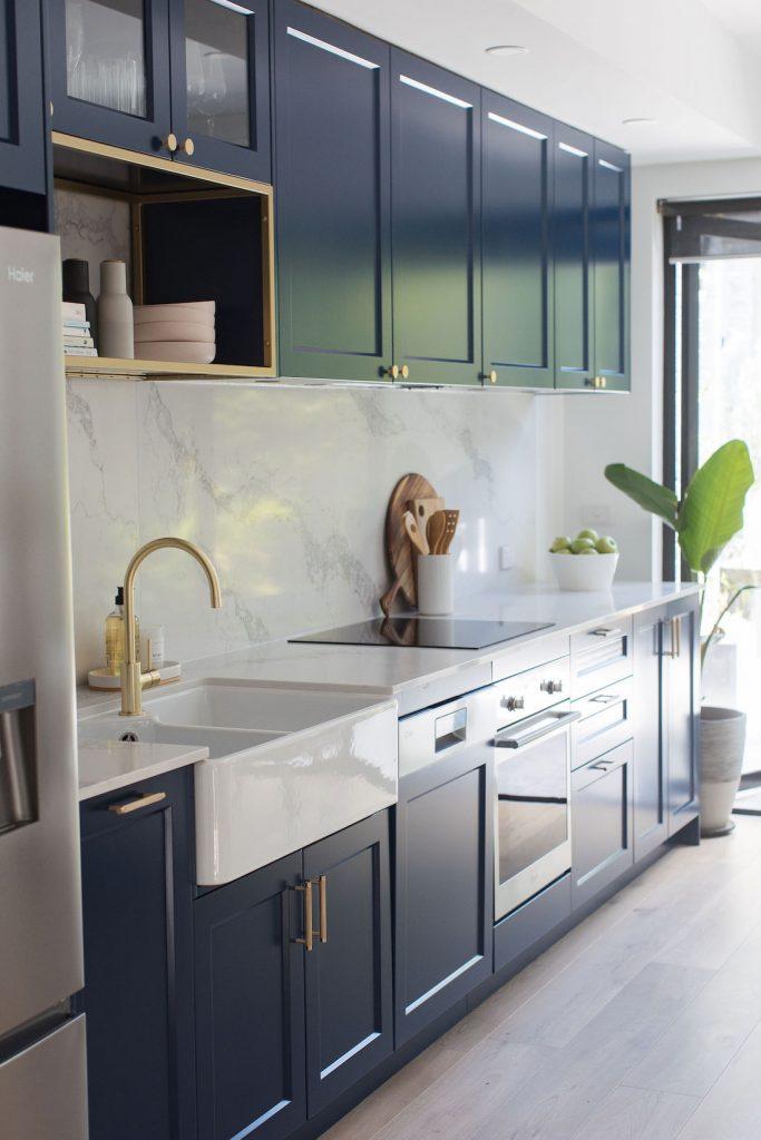 Brass And Walnut Accented Kitchen