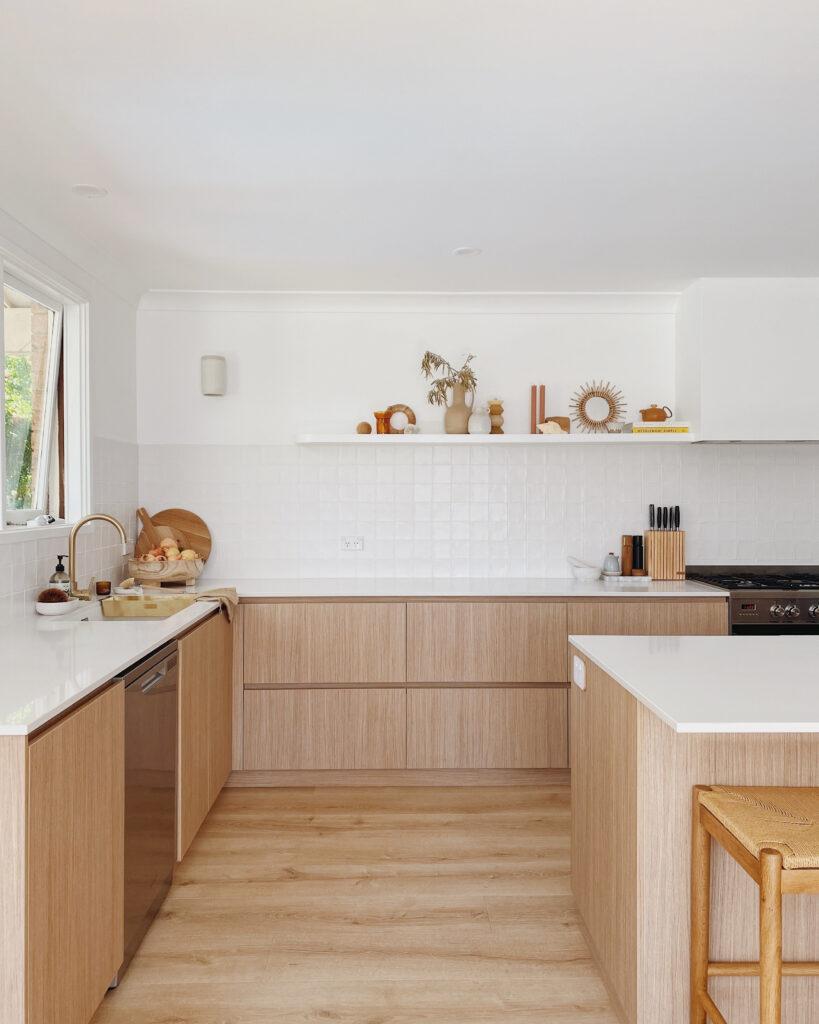 Organic kitchen design featuring white square handmade tile
