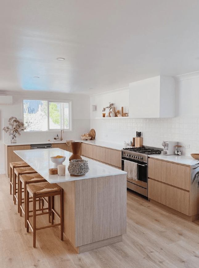 Modern minimalist kitchen design with warm materials palette