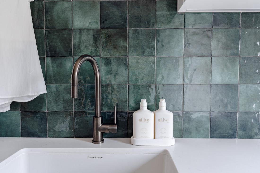 Moss green tile splashback