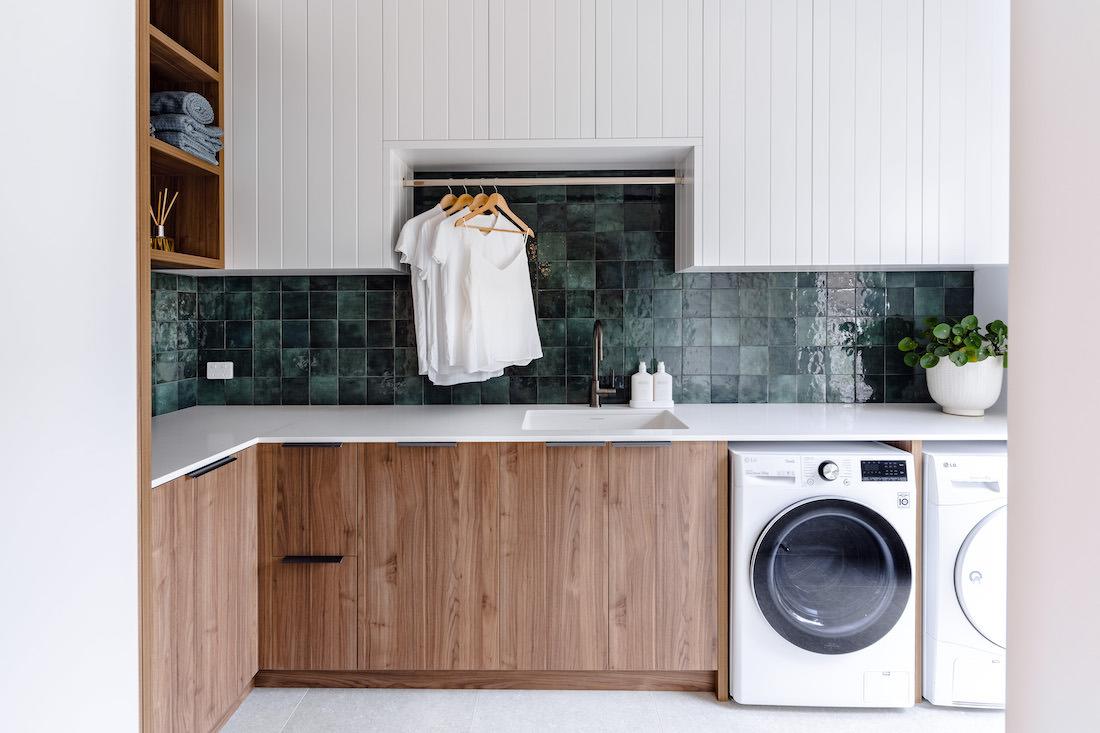 Moss green tile splashback laundry, the epitome of #laundrygoals!