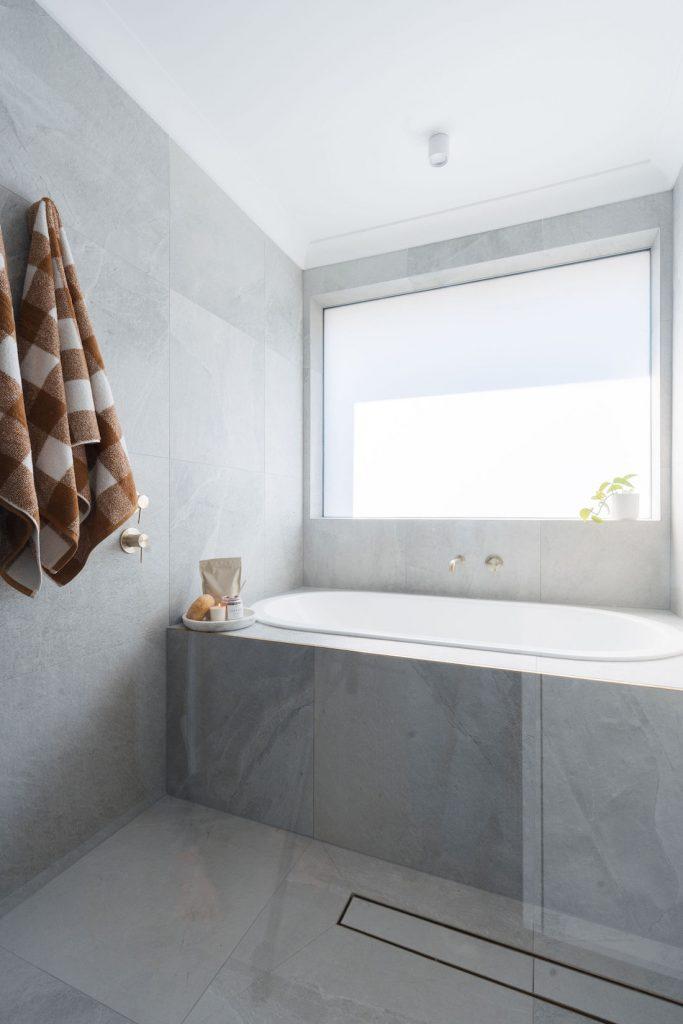 Bathroom renovation featuring grey stone-look tiles | Tile Republic