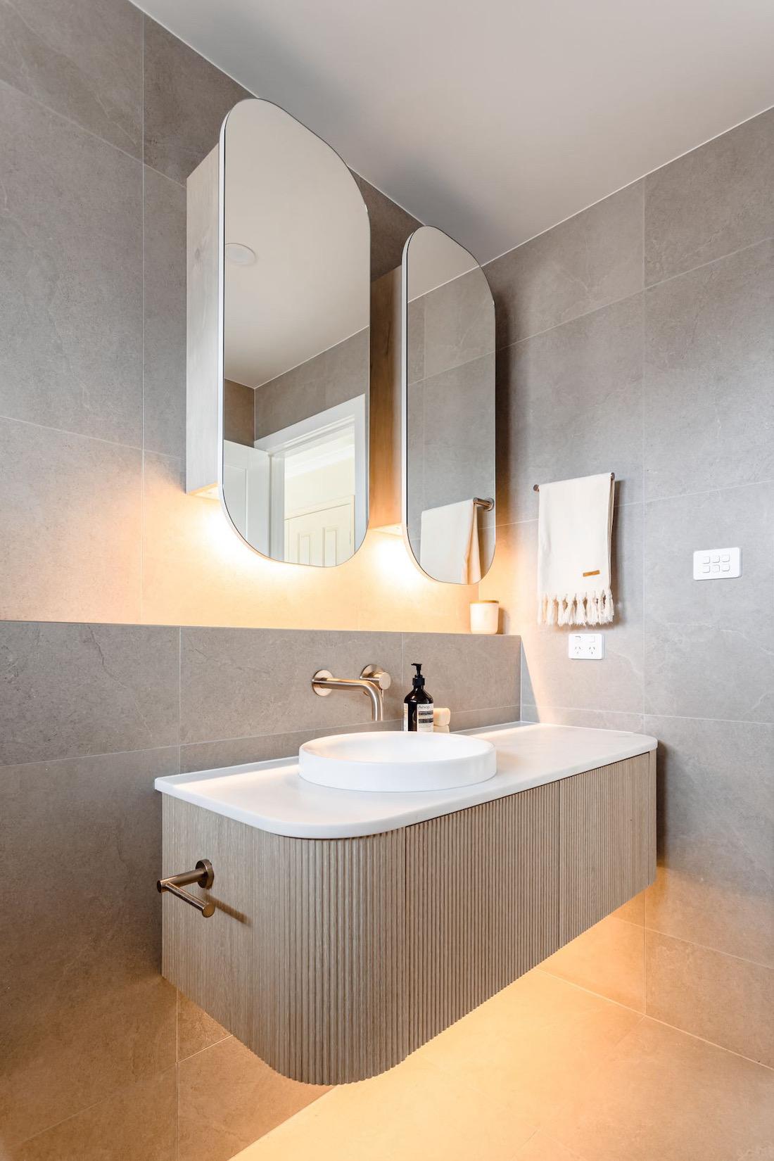 Lighting plan in serene tonal bathroom